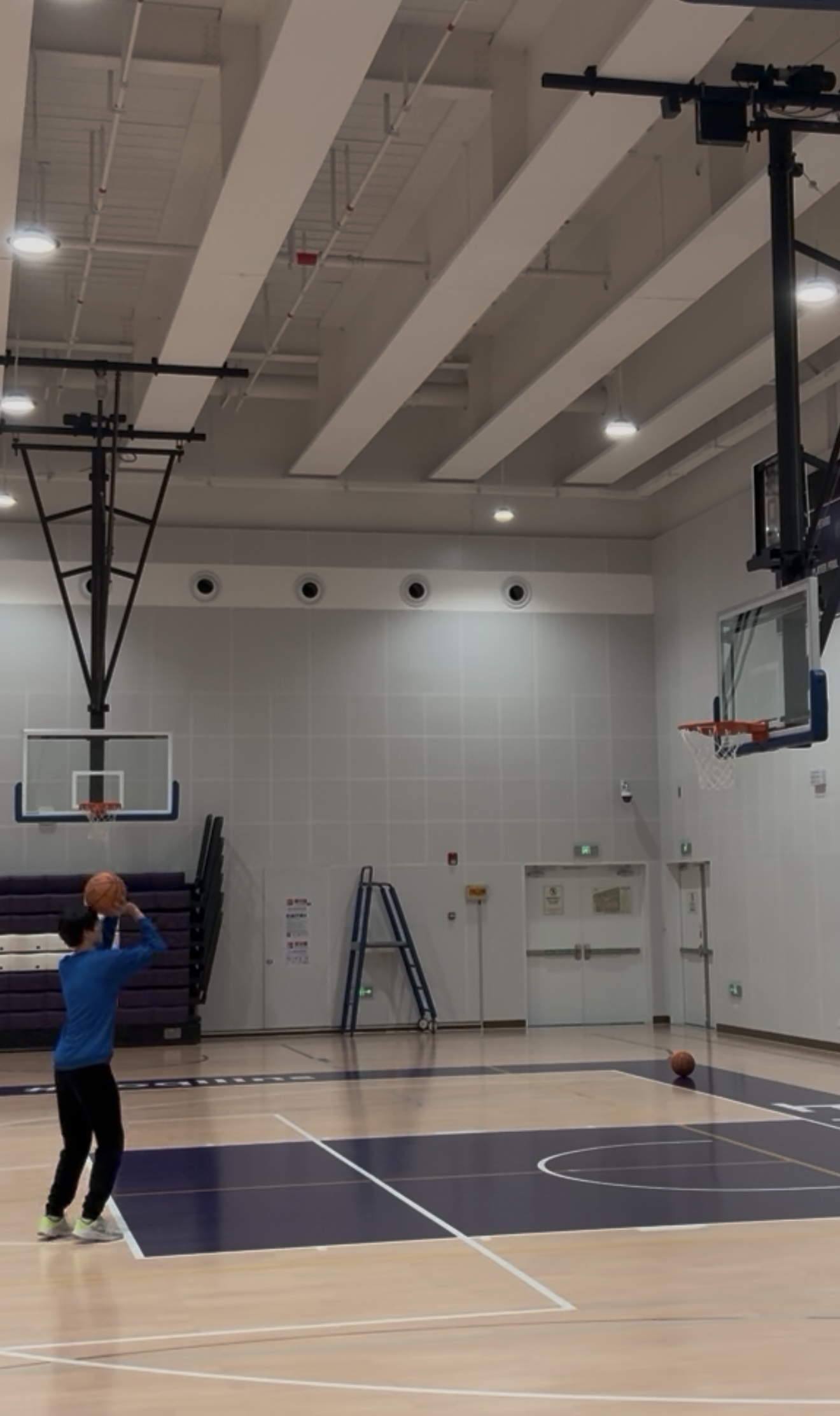 Playing basketball in an indoor gym