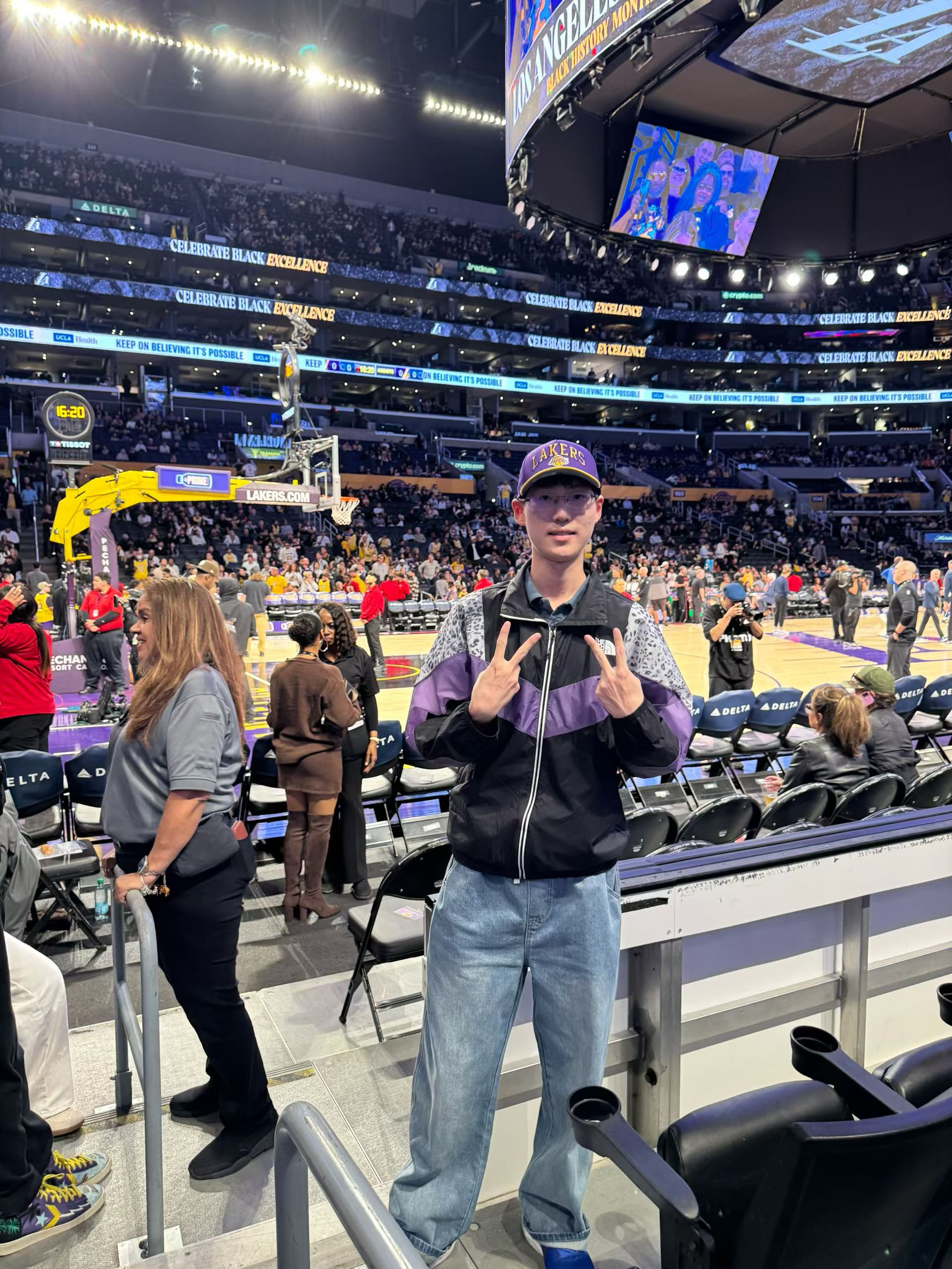 Watching a basketball game at the arena